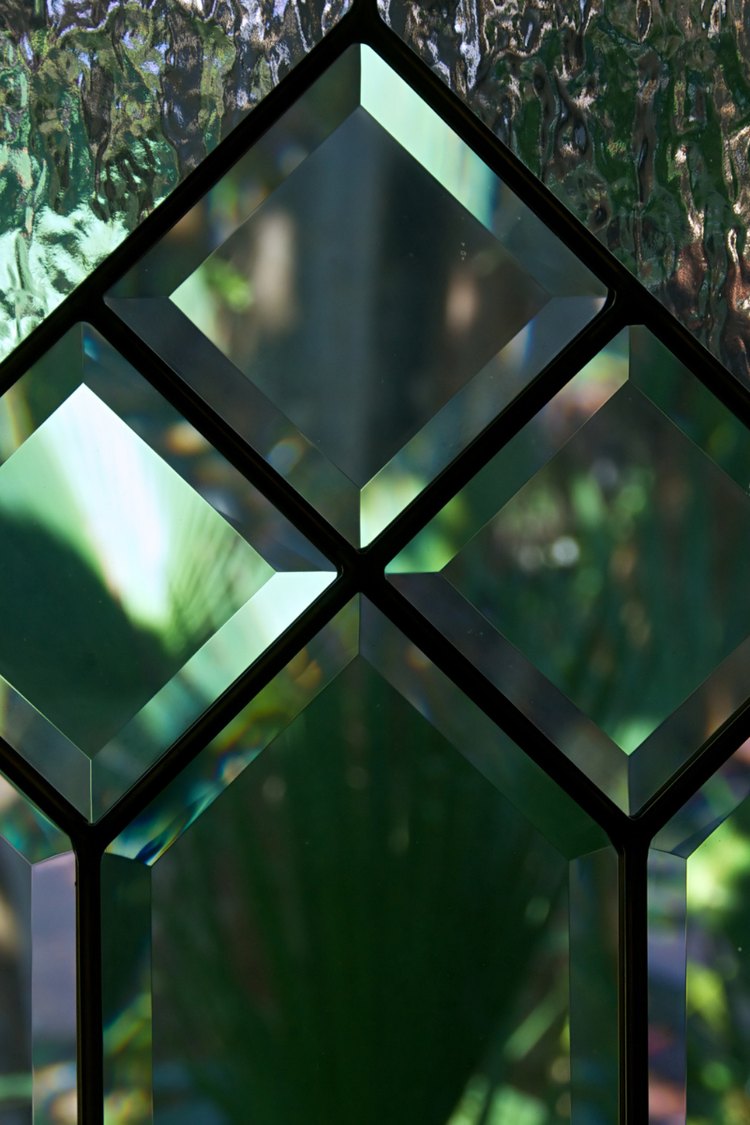 Close-up of leaded beveled glass panes with diamond pattern