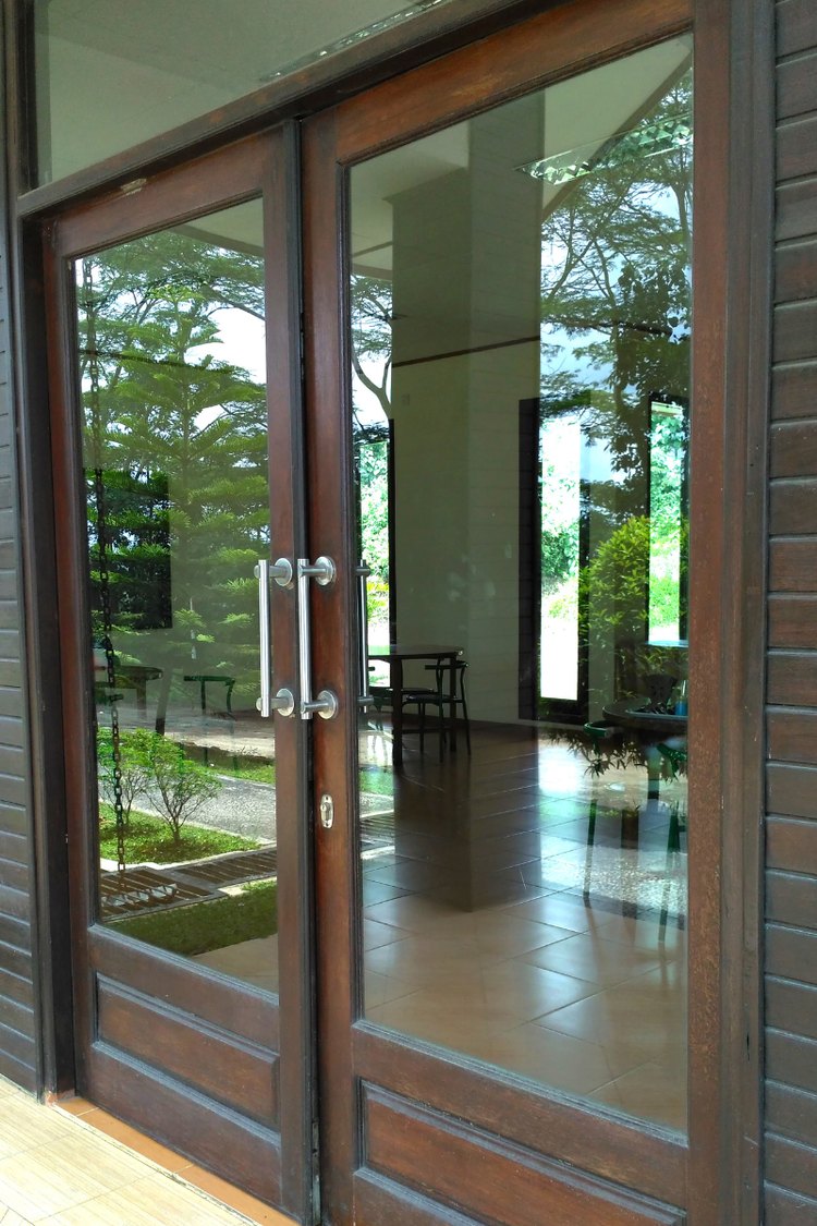 Pair of commercial glass entry doors with long pull handles