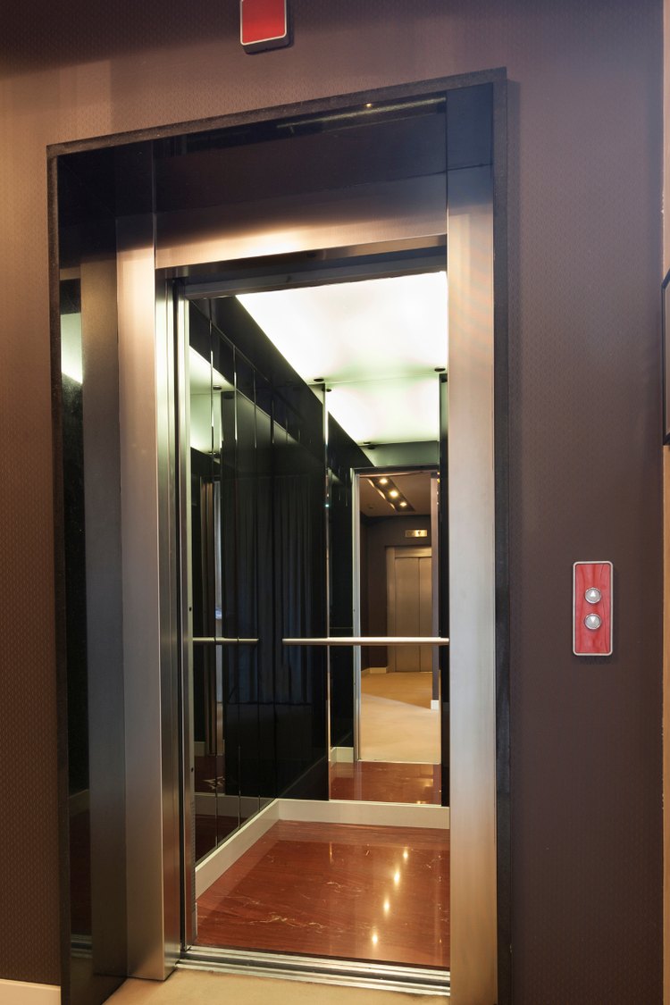 Elevator interior with a mirrored back wall