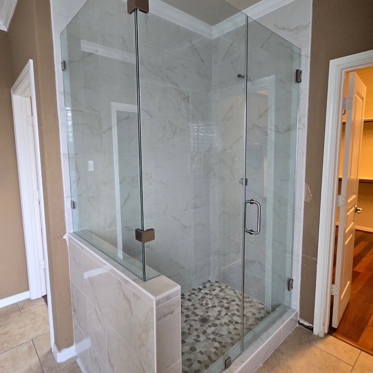 Frameless glass shower with black hardware