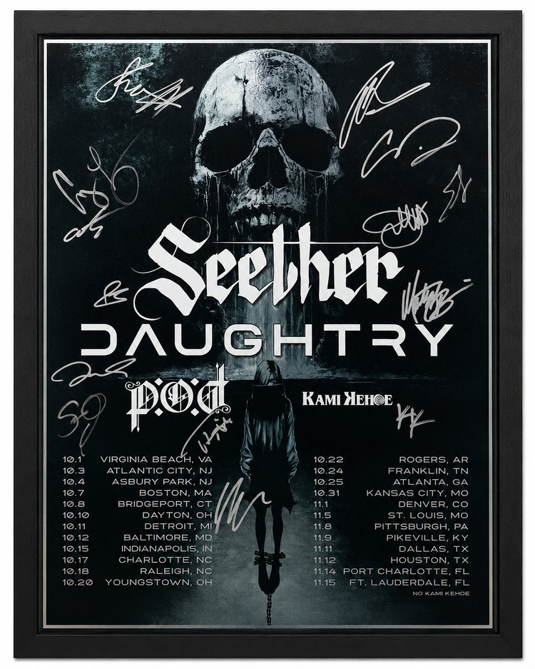 Signed concert poster in a black frame