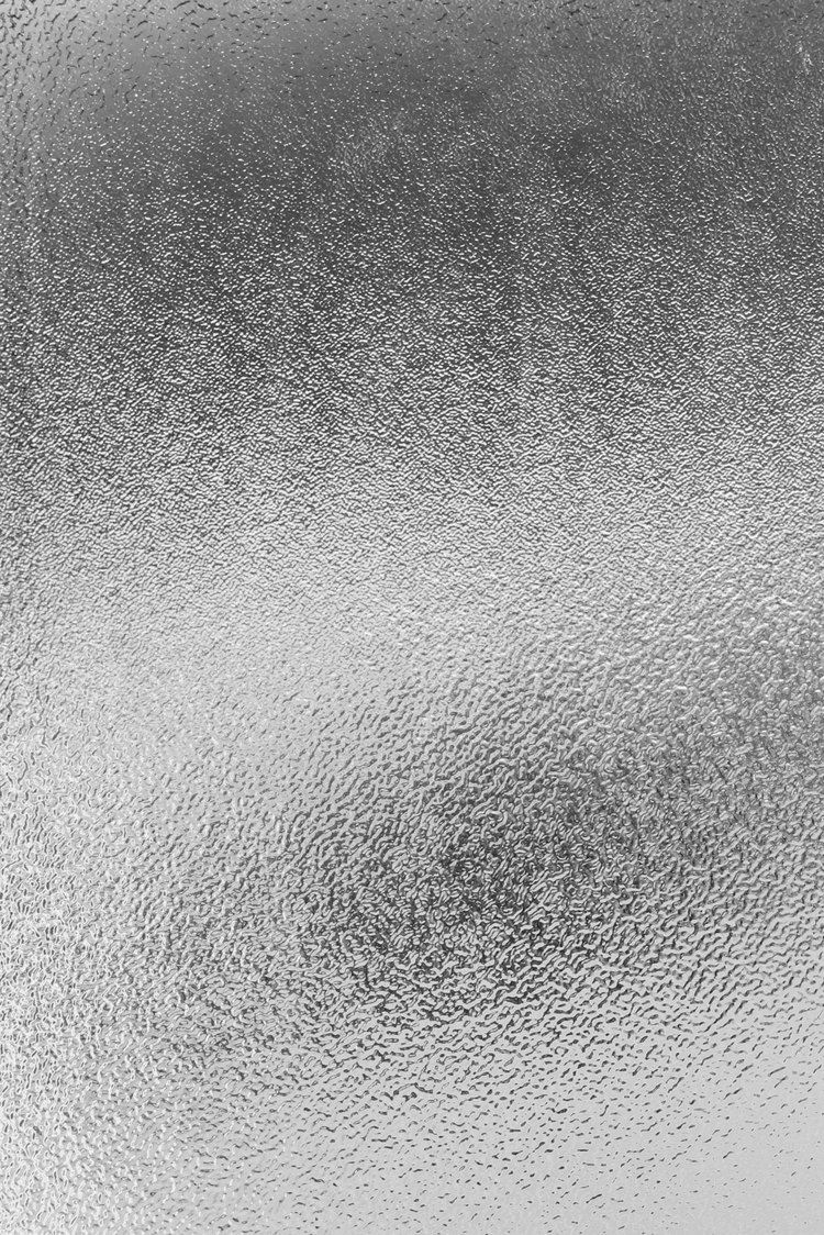 Close-up of textured obscure shower door glass