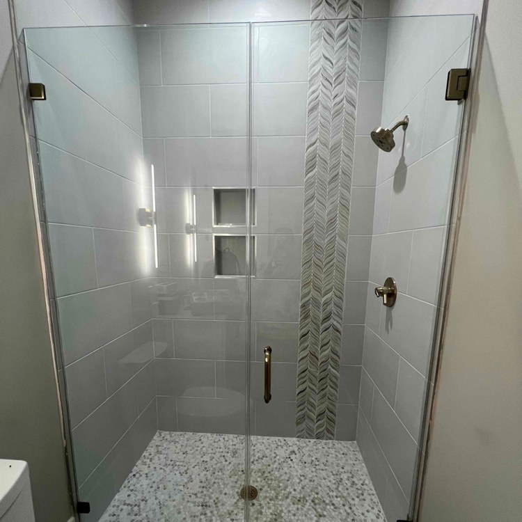 Glass shower door installed by DeSola Glass