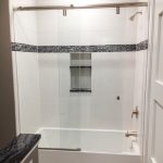 Glass shower door installed by DeSola Glass
