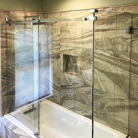 Glass shower door installed by DeSola Glass